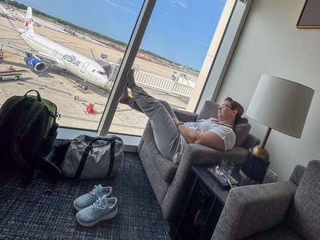 Steffi in the not-so-premium lounge at Orlando Airport